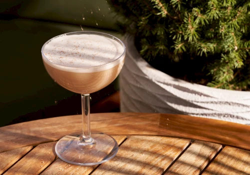 a cocktail on a wooden table